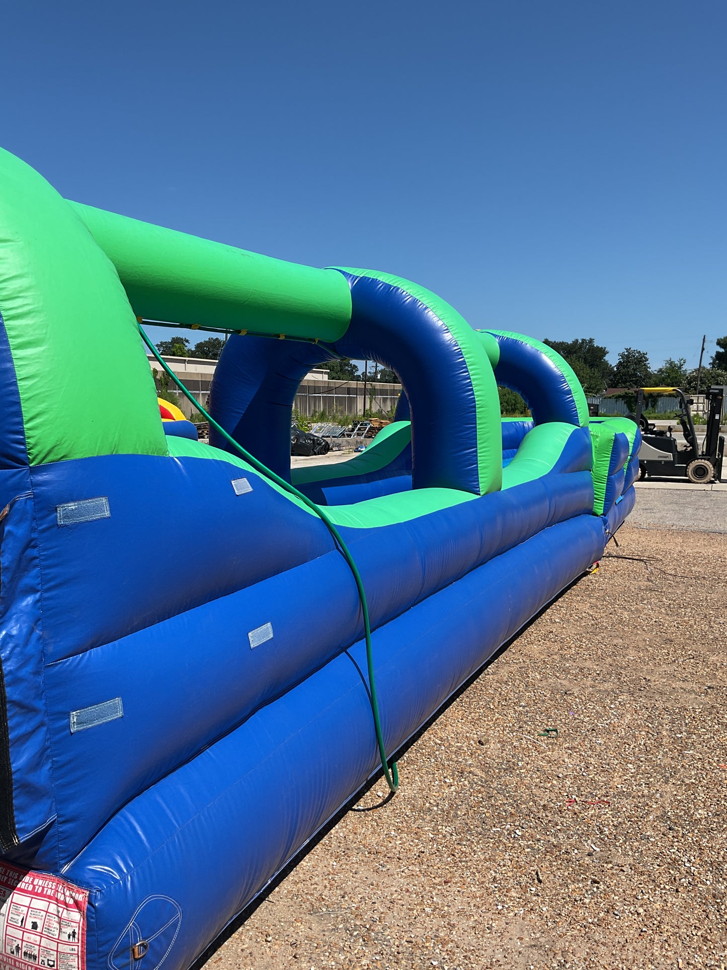 Green Blue Slip-n-Slide with pool and landing attachment