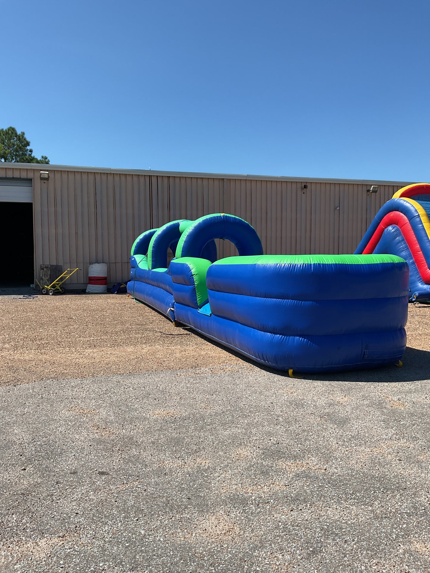 Green Blue Slip-n-Slide with pool and landing attachment
